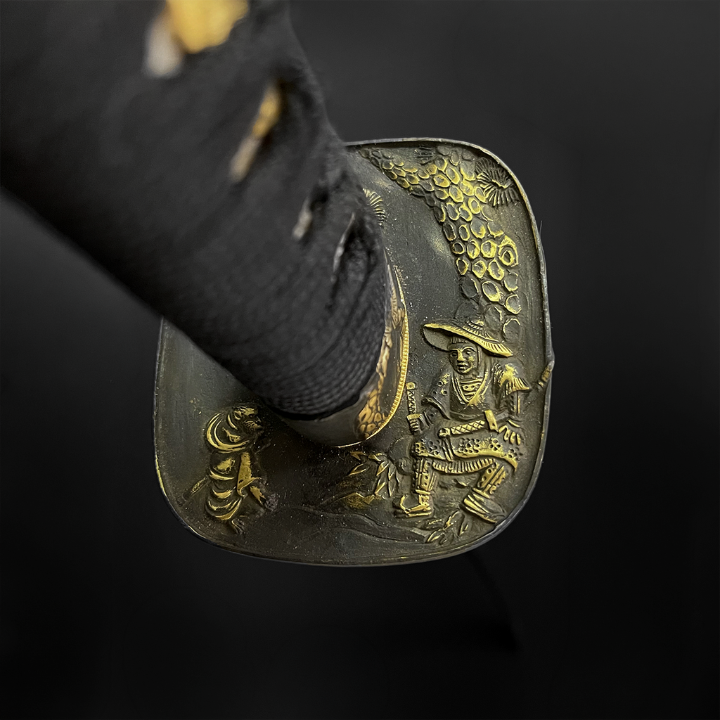 Katana tsuba with gold warrior carving | Pacific Solution.