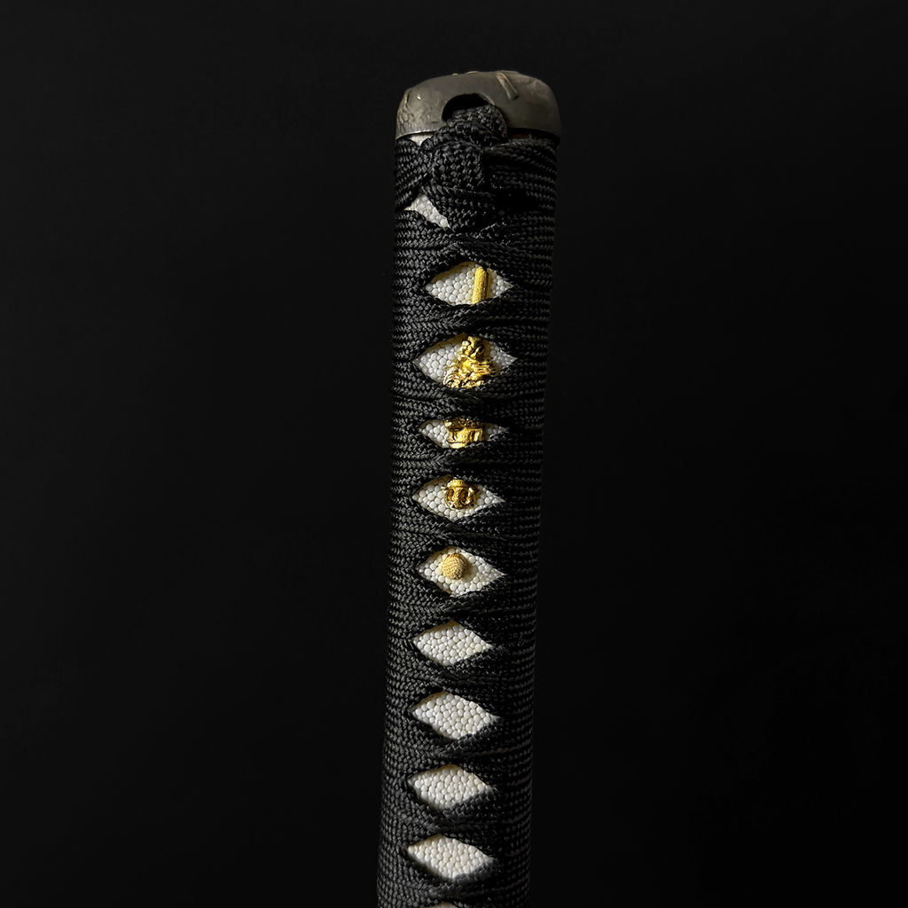 A black wrapped katana sword handle। Pacific Solution.