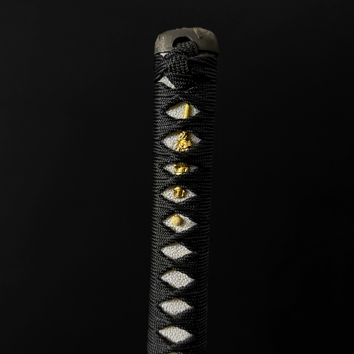 A black wrapped katana sword handle। Pacific Solution.