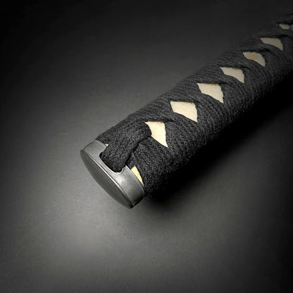 Close-up of Musha Iaido Martial Arts Practice Katana Sword handle with black cord wrapping