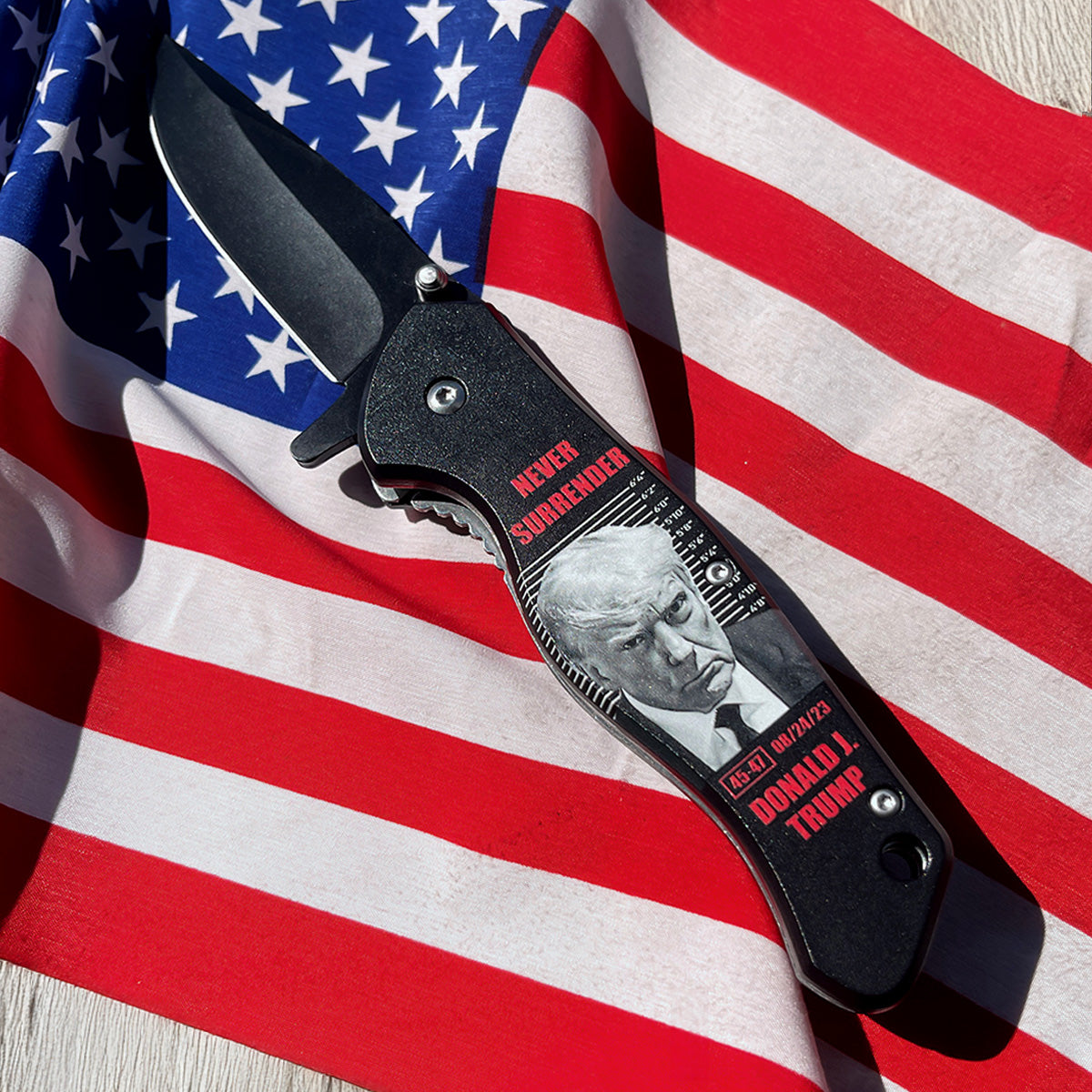 President Trump Knife - Never Give Up Pocket Knife featuring a unique design on a black handle