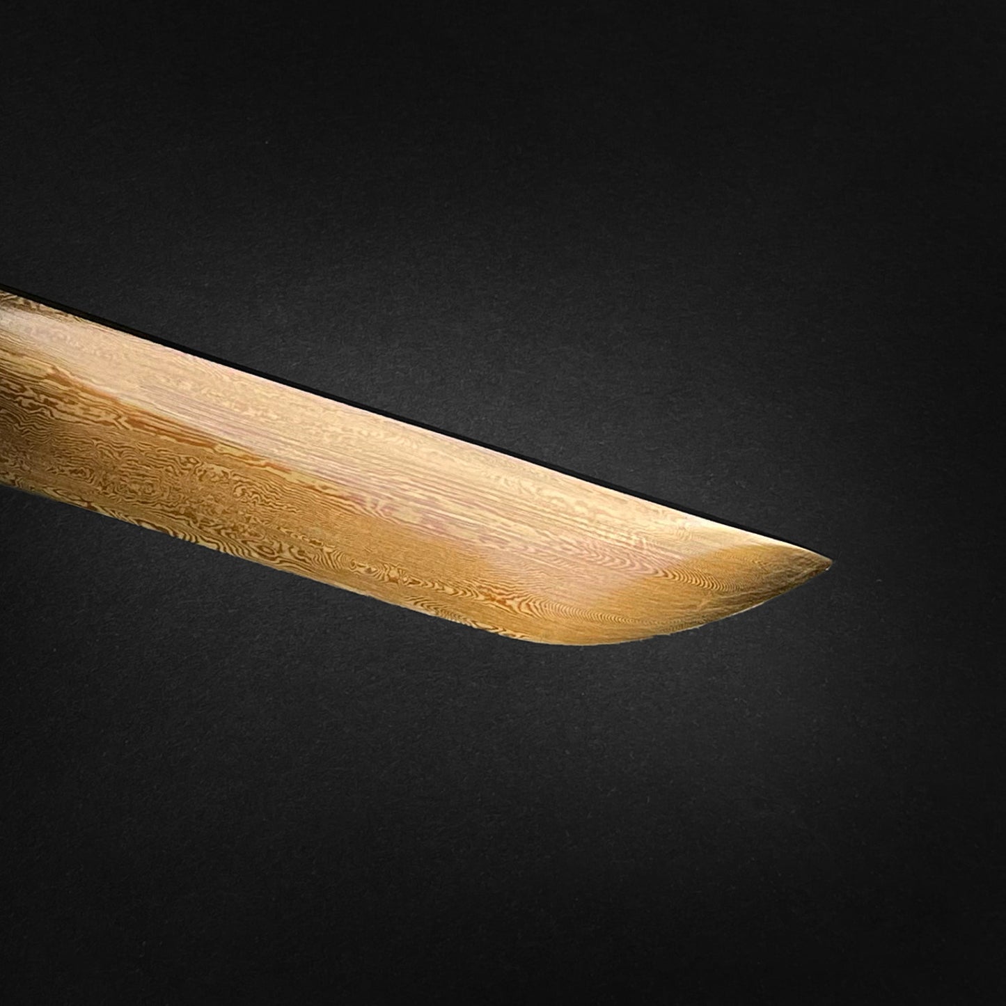 Close-up of a Wholesale Damascus Katana for Sale showcasing the blade's detailed patterns and craftsmanship