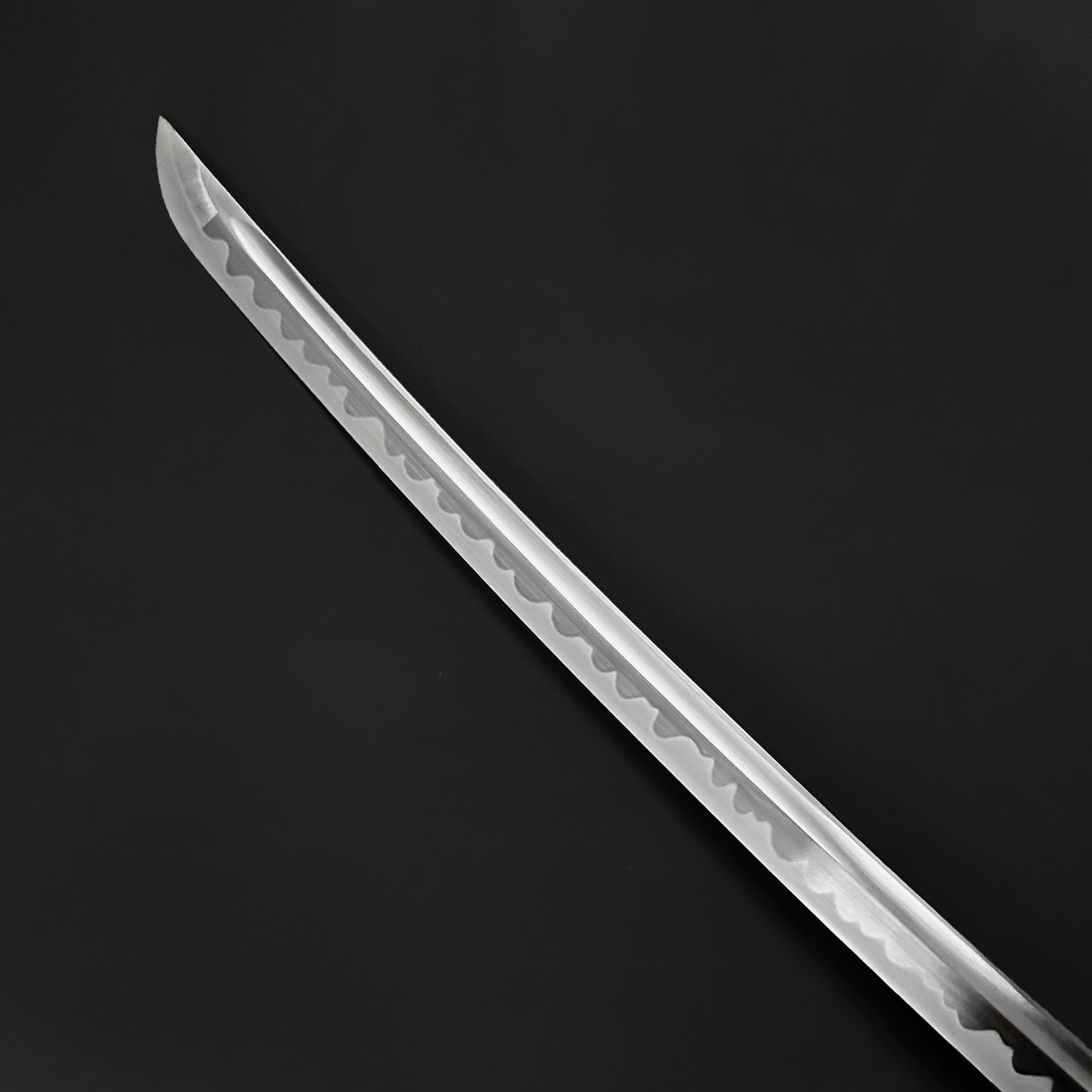 Close-up of the blade of a Wholesale Musashi Samurai Katana Sword showcasing its sharp, intricate design