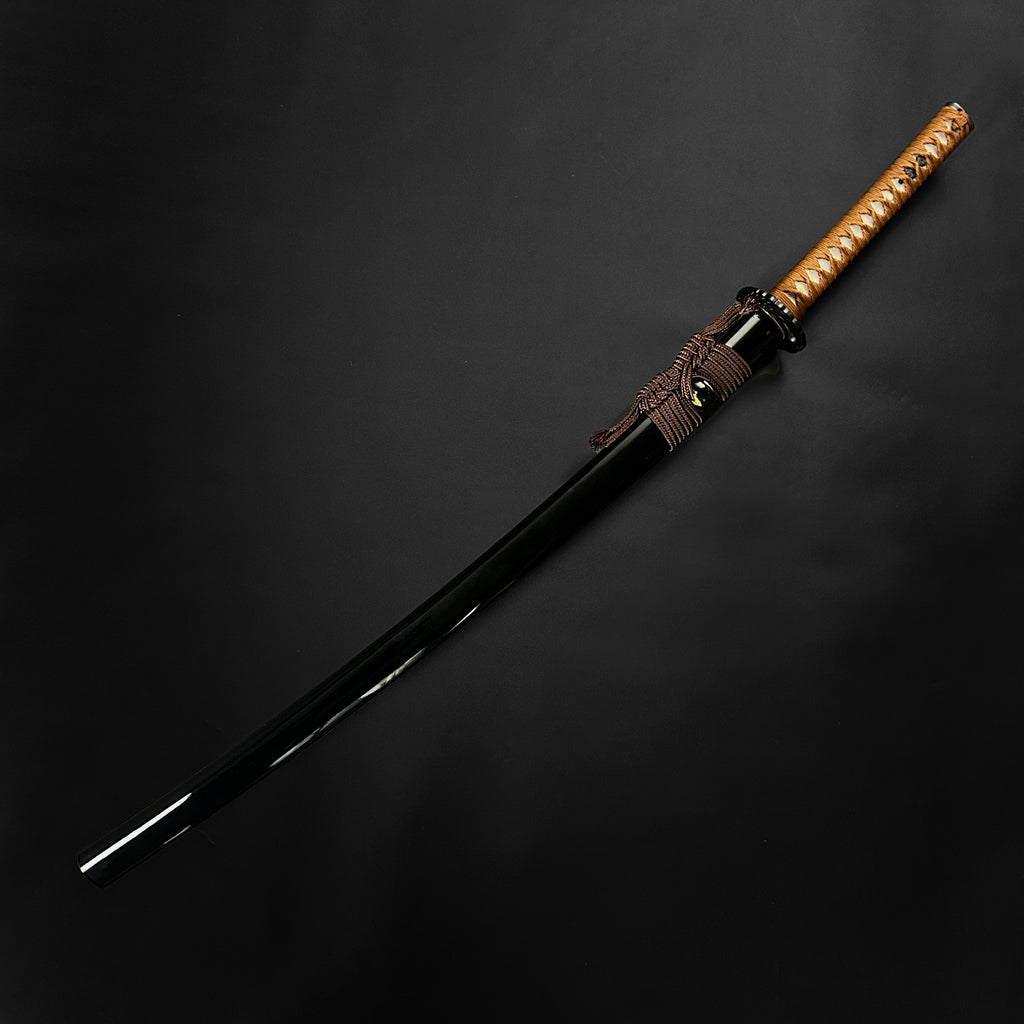 Wholesale Musashi Samurai Katana Sword with a sleek black blade and a traditional wrapped handle
