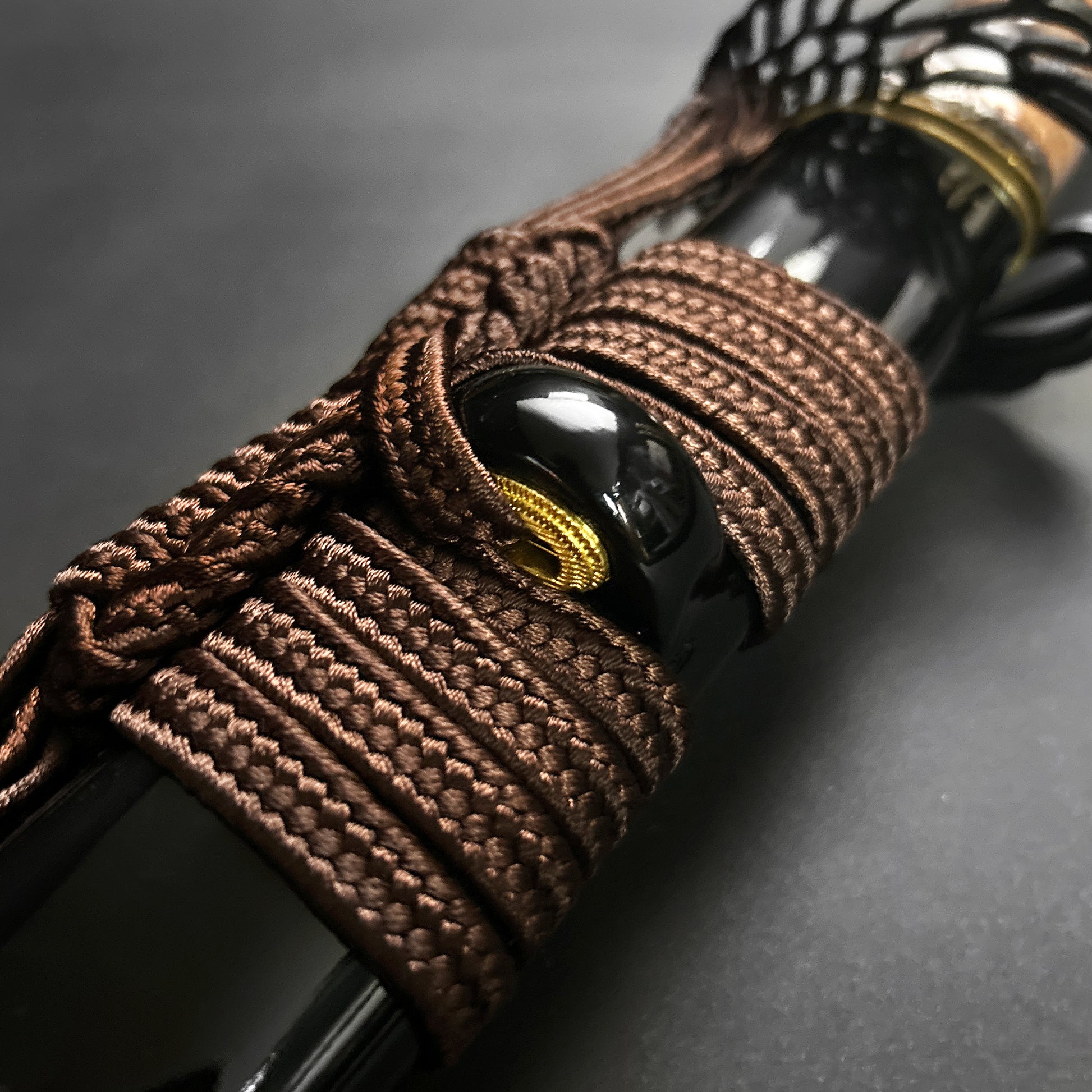 Detail view of Wholesale Musashi Samurai Katana Sword handle with intricate cord wrapping