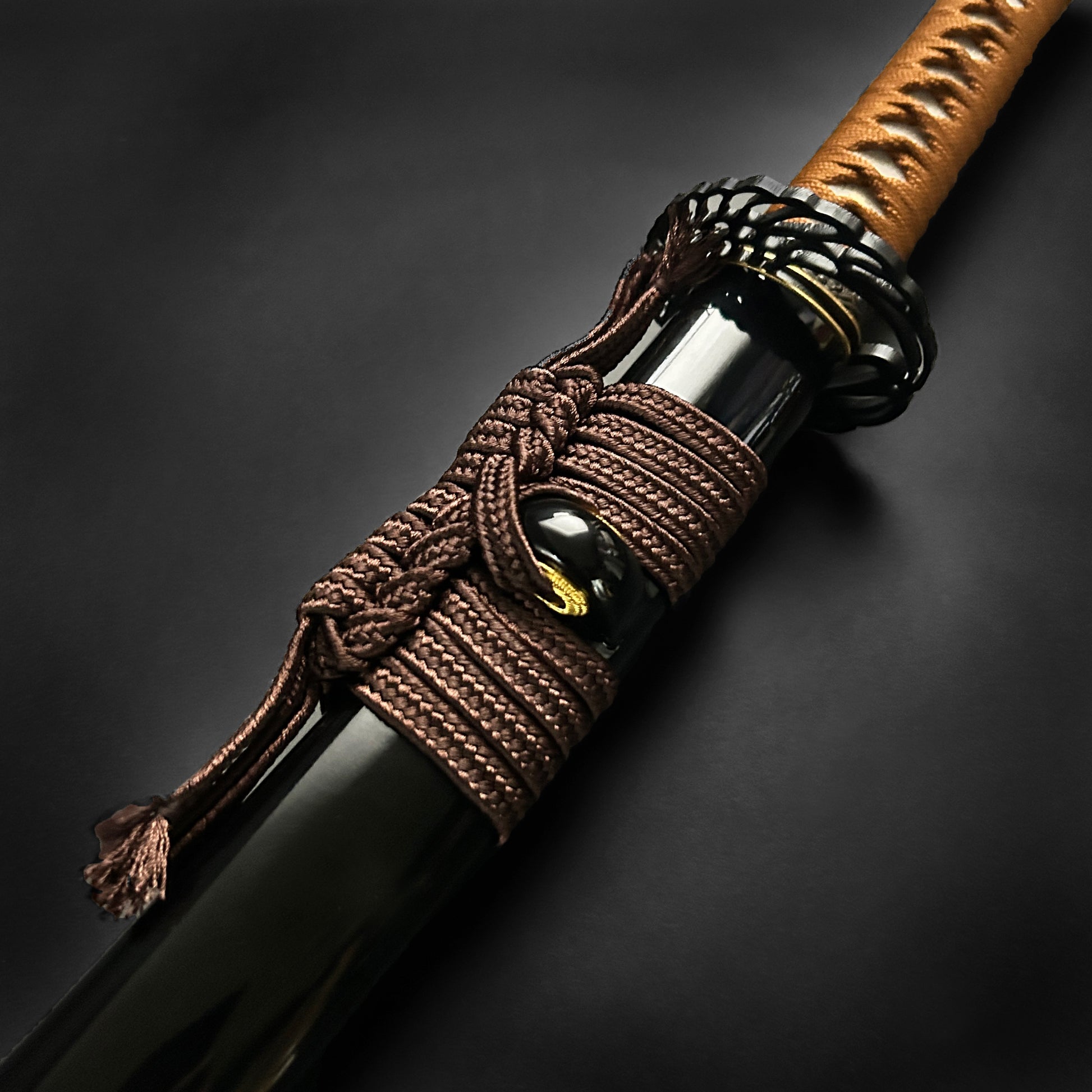 Close-up of a Wholesale Musashi Samurai Katana Sword handle with intricate detailing and traditional grip