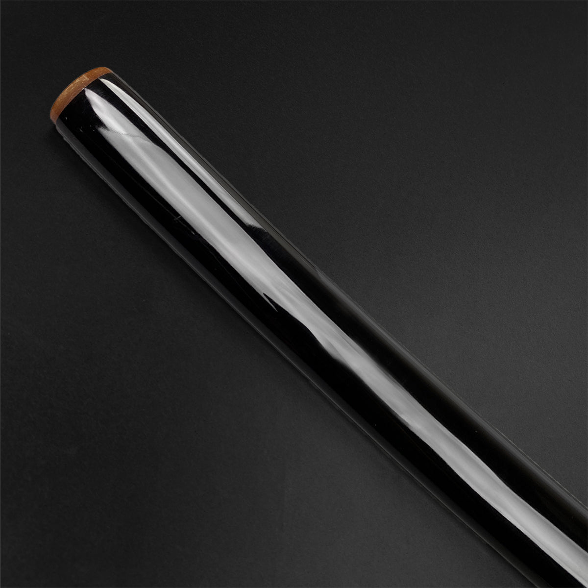 Close-up of the scabbard of a Wholesale Musashi Samurai Sword Katana in glossy black finish
