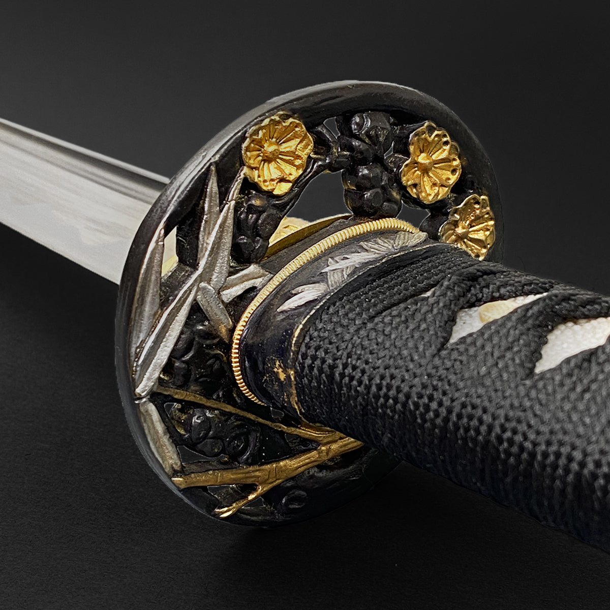Close-up of Wholesale Musashi Samurai Sword Katana with ornate tsuba and intricate handle design