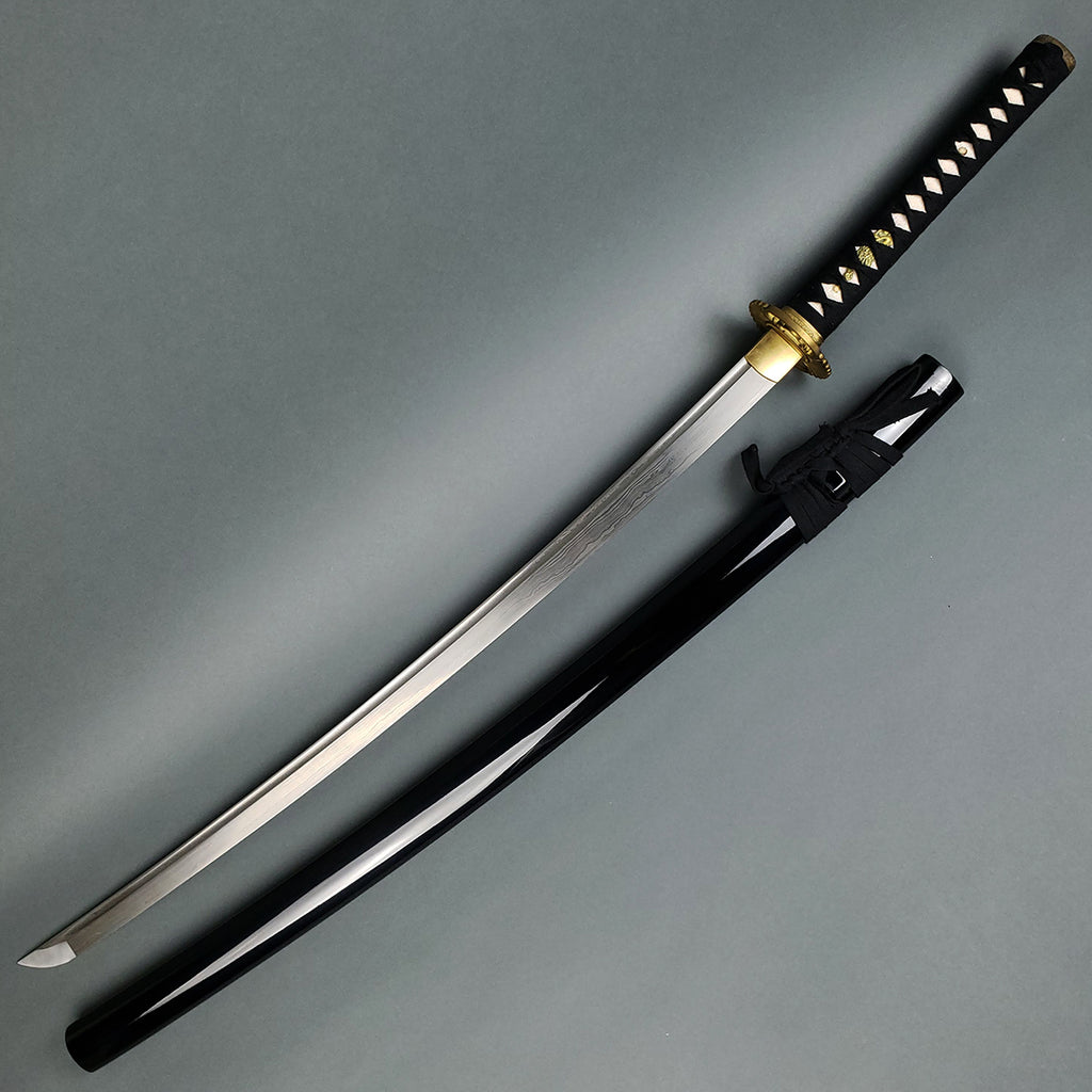 A hand-forged 'Kujaku' (Peacock) Katana with a detailed Kiku gata style tsuba, featuring a peacock tail with its feathers spread. The blade has a Damascus pattern and integrated Bo-Hi.