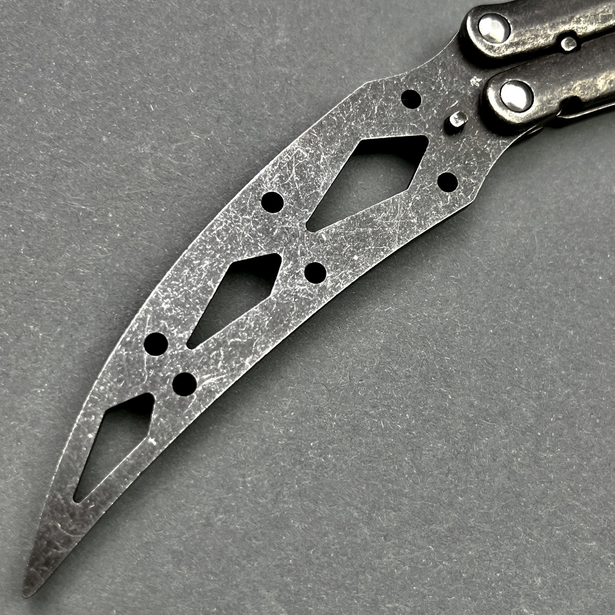 Pacific Solution Butterfly Knife Trainer Balisong Practice Knife with a durable, textured blade for safe training