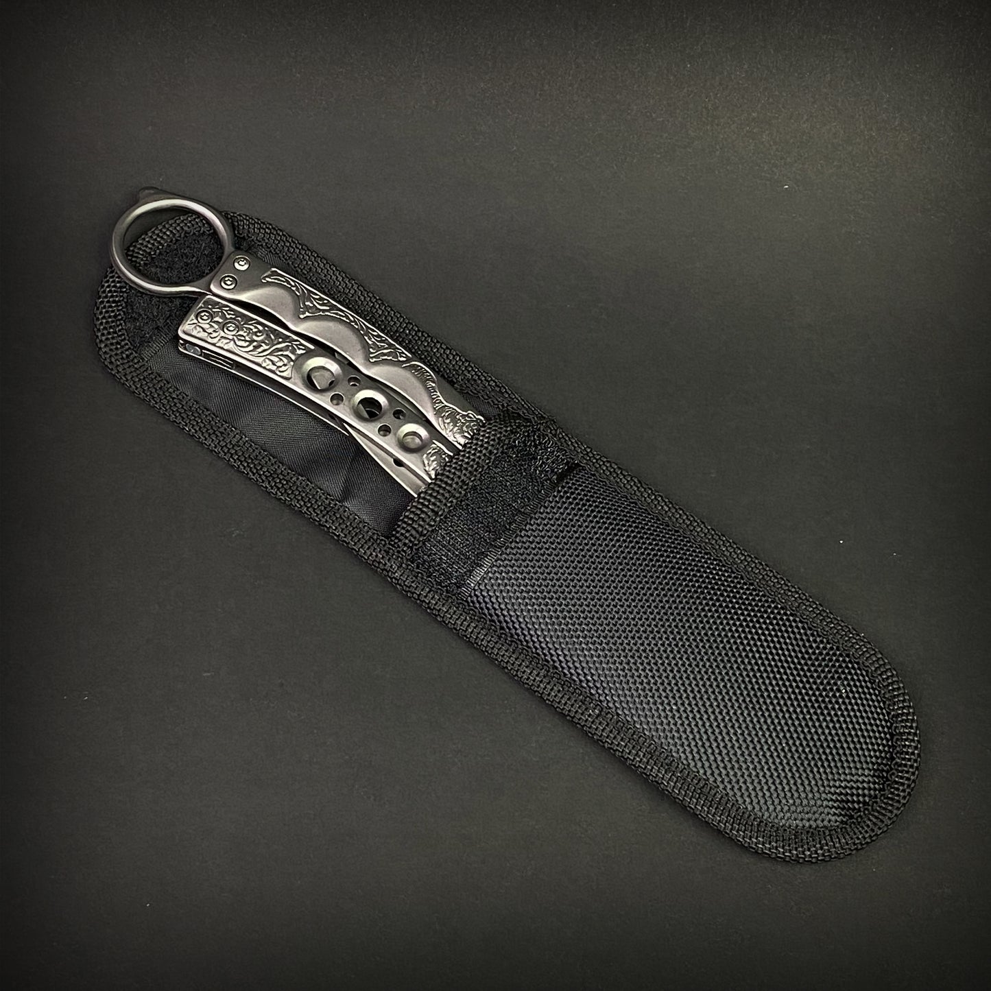 Chrome Butterfly Trainer - Balisong Practice Knife in a durable black nylon sheath for safe storage