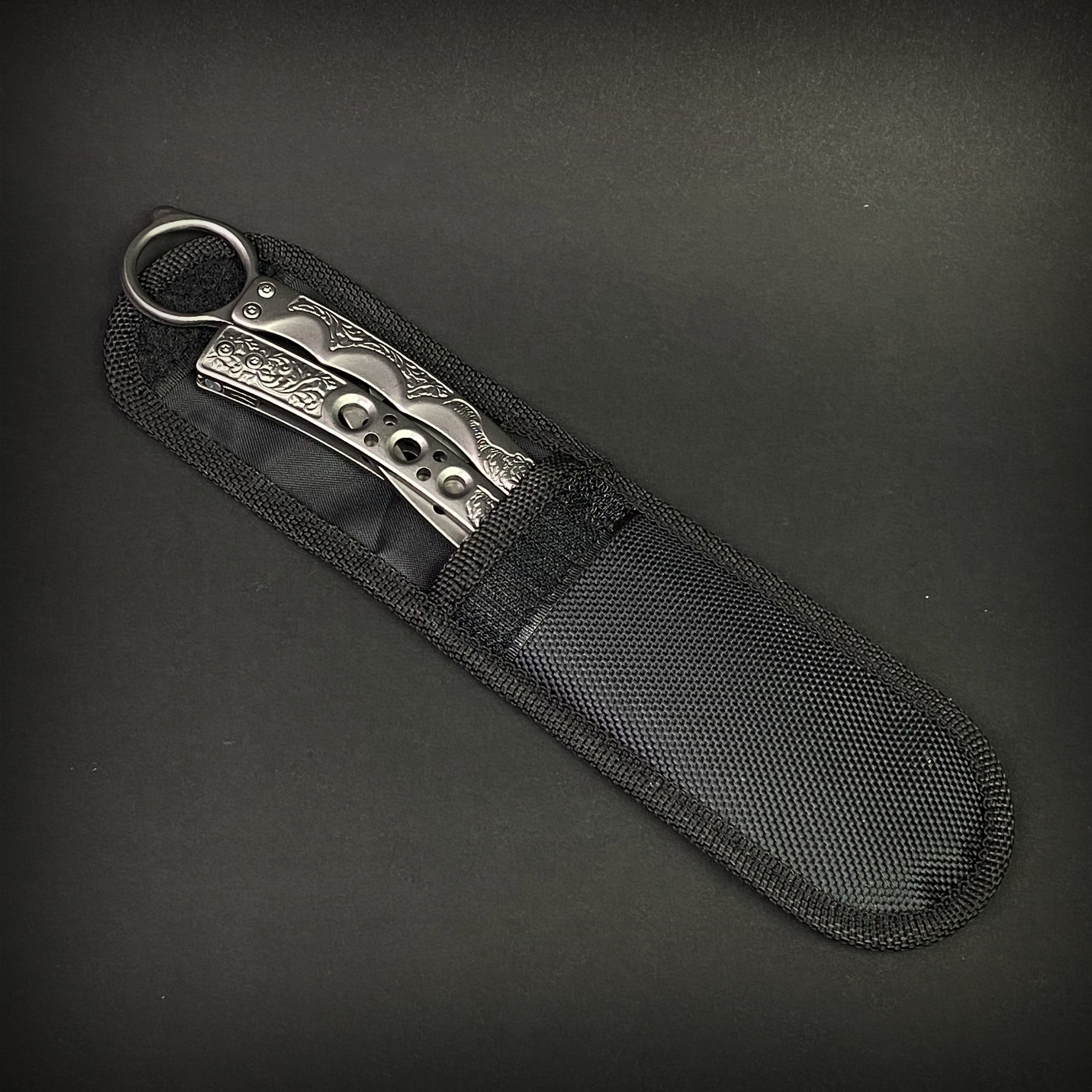 Chrome Butterfly Trainer - Balisong Practice Knife in a durable black nylon sheath for safe storage