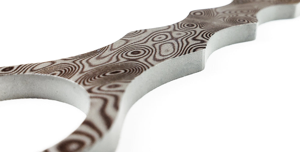 Falcon Damascus tactical knife with an intricately designed handle for optimal grip and style