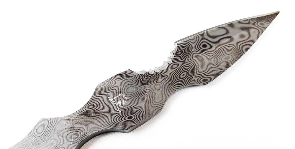 Falcon Damascus tactical knife with intricate patterns and a sharp, durable blade for outdoor use