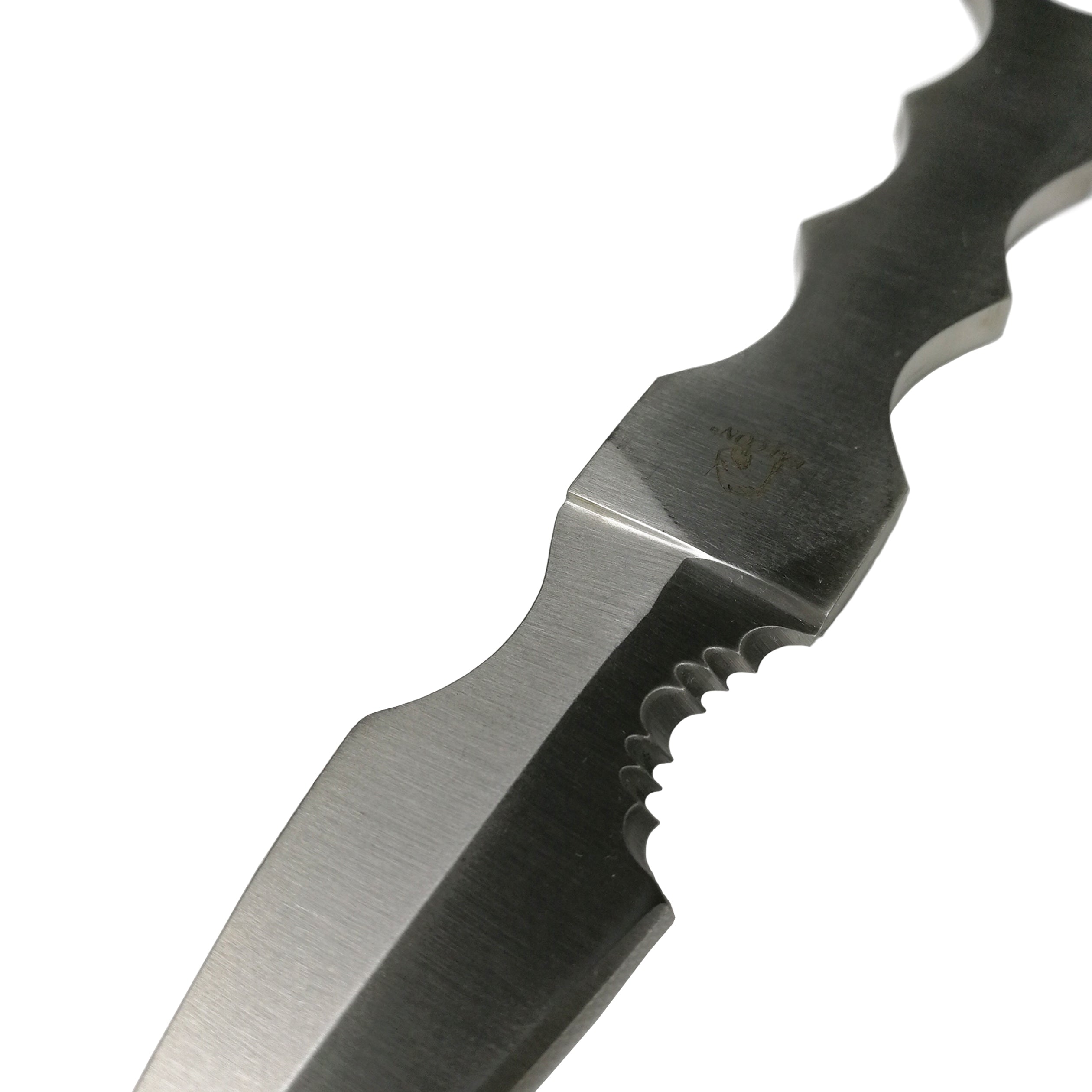 Close-up of Falcon fixed blade survival knife showing serrated edge and finger grooves on the handle