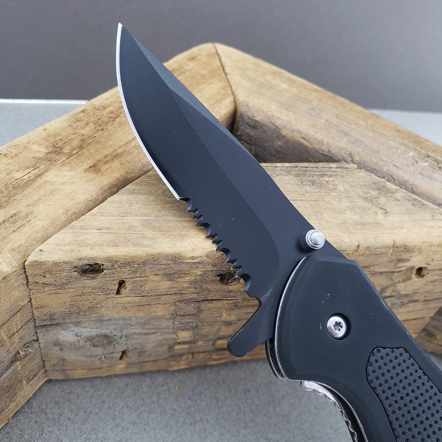 Falcon Spring Assisted Knife with a sleek black blade and ergonomic grip for easy handling