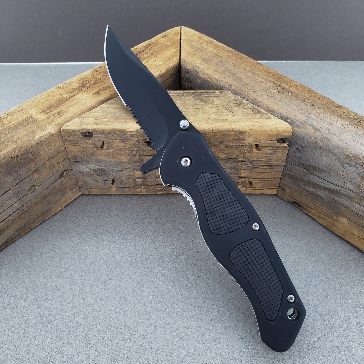 Falcon Spring Assisted Knife with a sleek black handle and durable blade for everyday use