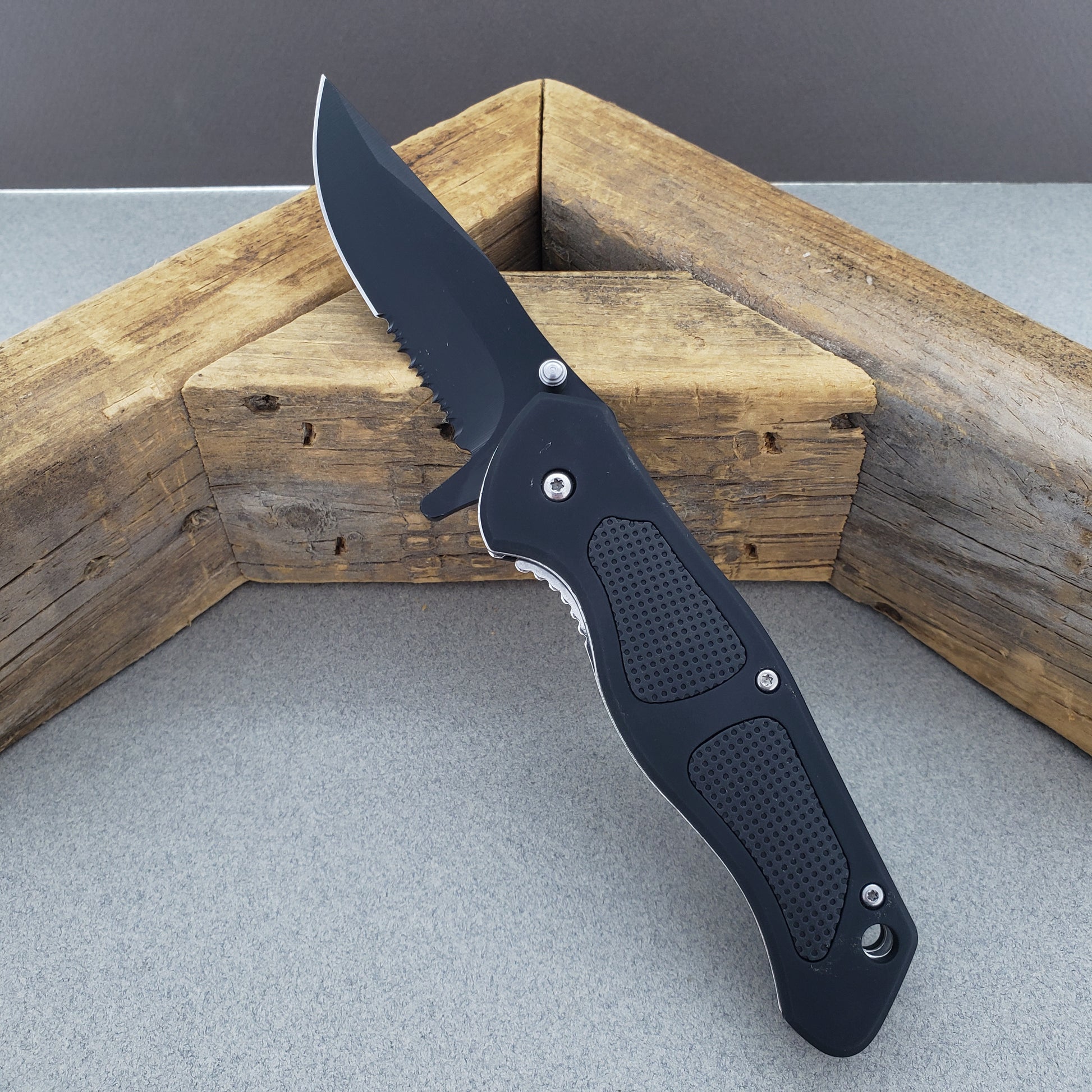 Falcon Spring Assisted Knife with a sleek black handle and durable blade for everyday use
