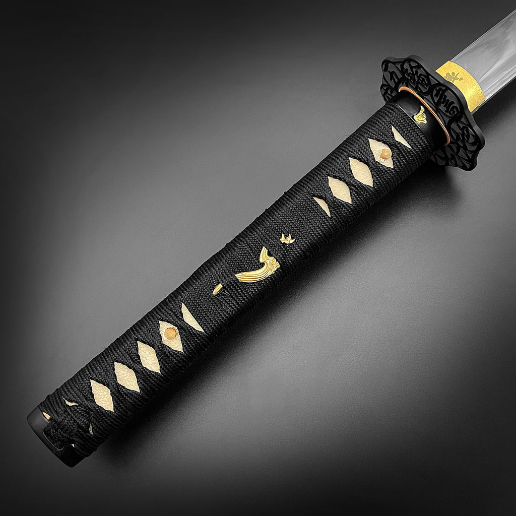 Musashi Katana for Sale featuring a black textured handle with intricate gold designs and a polished blade