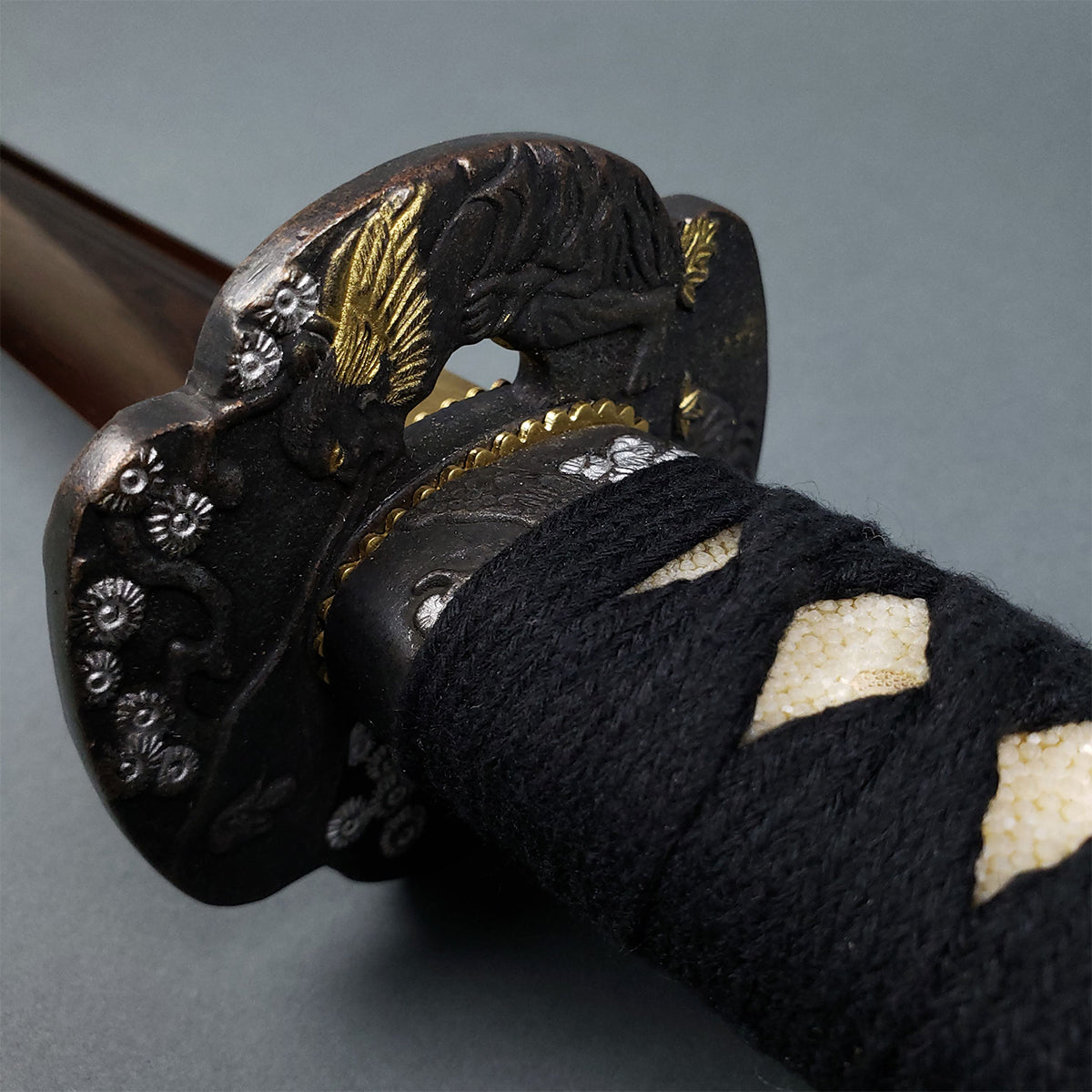 Musha Red Damascus Samurai Katana Sword with intricate tsuba and black fabric handle for collectors