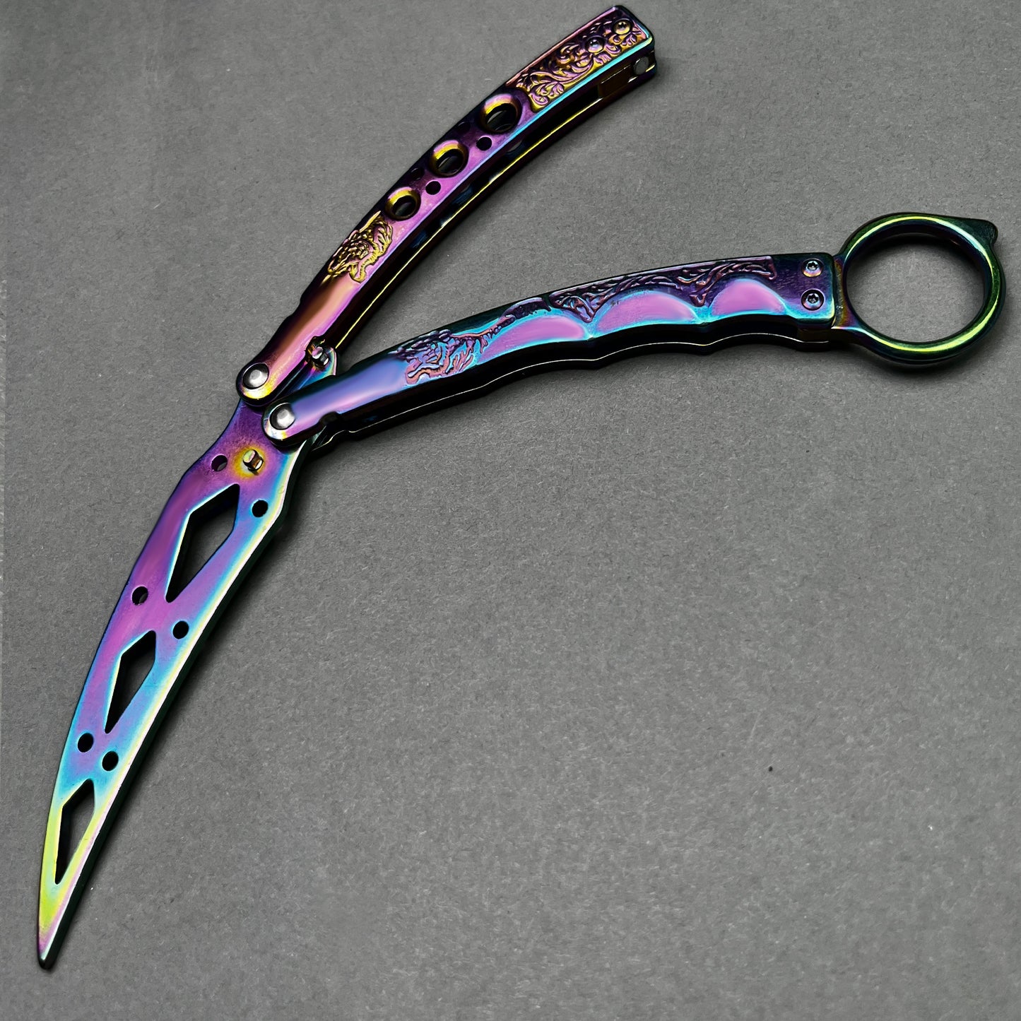Rainbow Butterfly Trainer Balisong practice knife with a sleek design and vibrant colors for safe flipping
